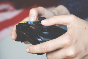 Photograph of somebody holding an Xbox controller