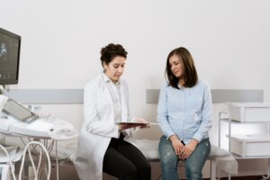 A pregnant woman having a consultation with a doctor